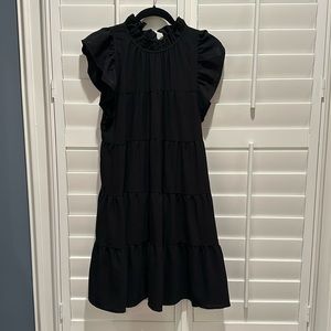 Black dress with tie back and ruffled sleeves